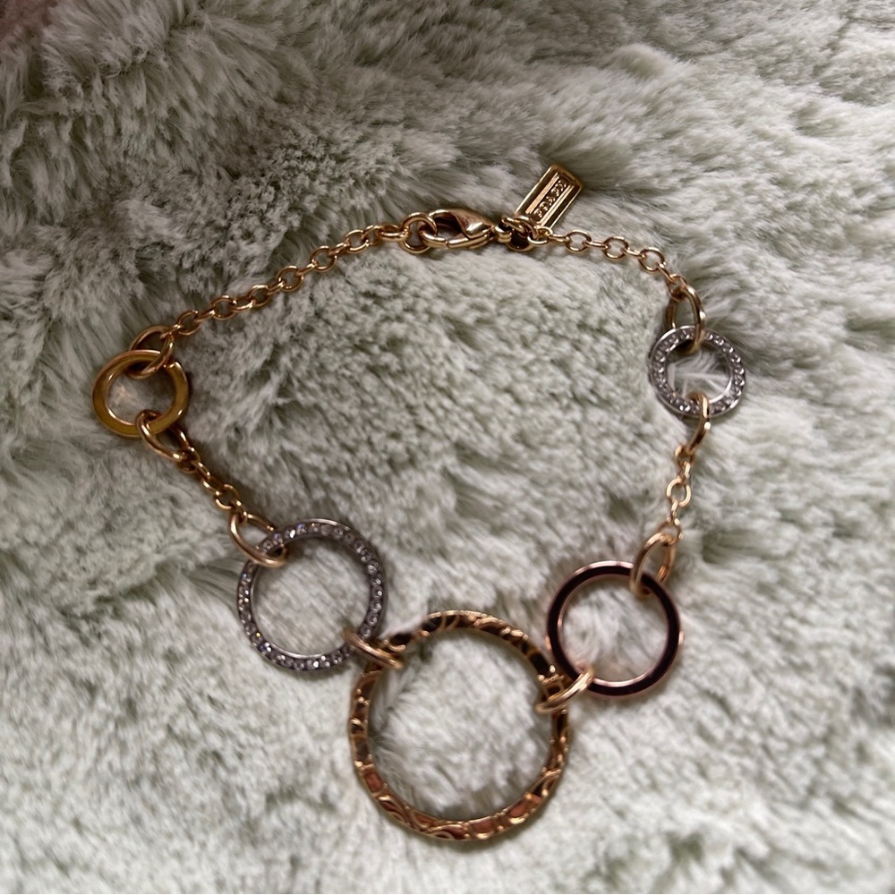 Coach Gold tone, rose gold tone & silver tone cz COACH bracelet.
